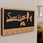 Brown and black wooden wall key holder with Sweet Home text, birds sitting on tree branch, 7 hook key organize